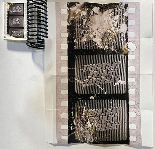 Photo of an open book, images of film